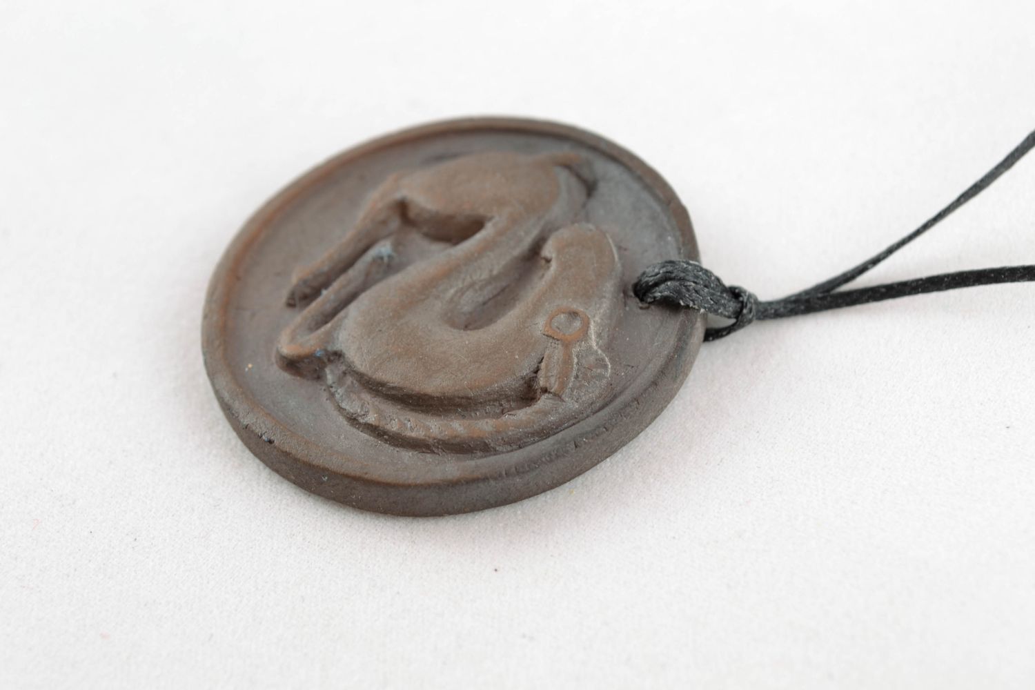 Round pendant made of black smoked ceramics photo 5