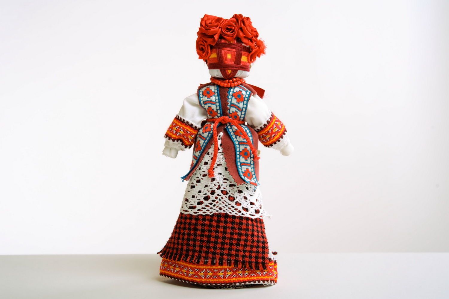 Red fabric doll photo 1