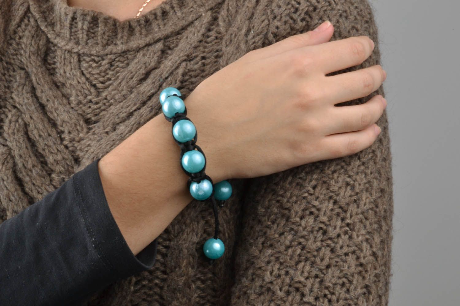 Braided bracelet with blue beads photo 1