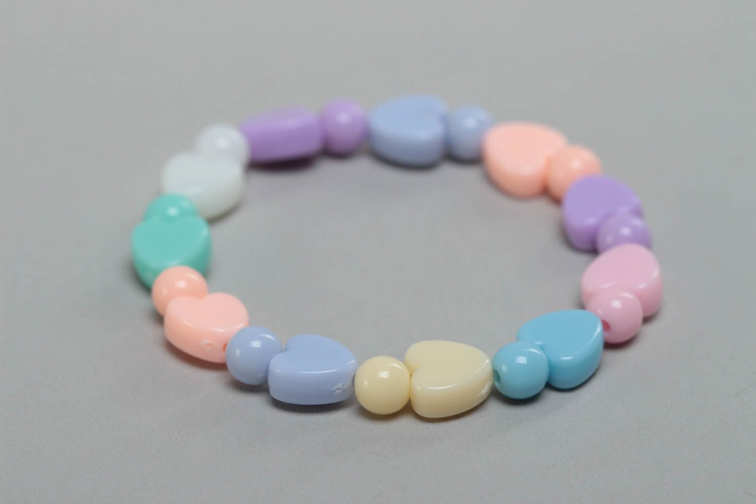 Colorful handmade designer plastic bead bracelet with heart shaped charms photo 3