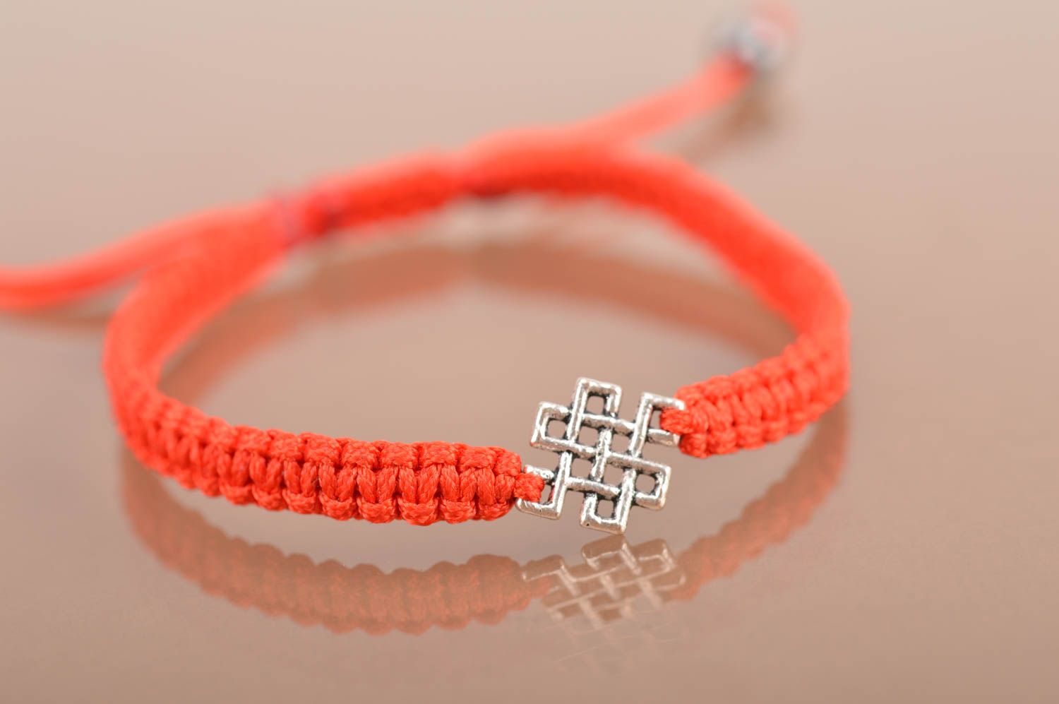 Handmade designer woven red silk friendship bracelet with metal insert photo 3
