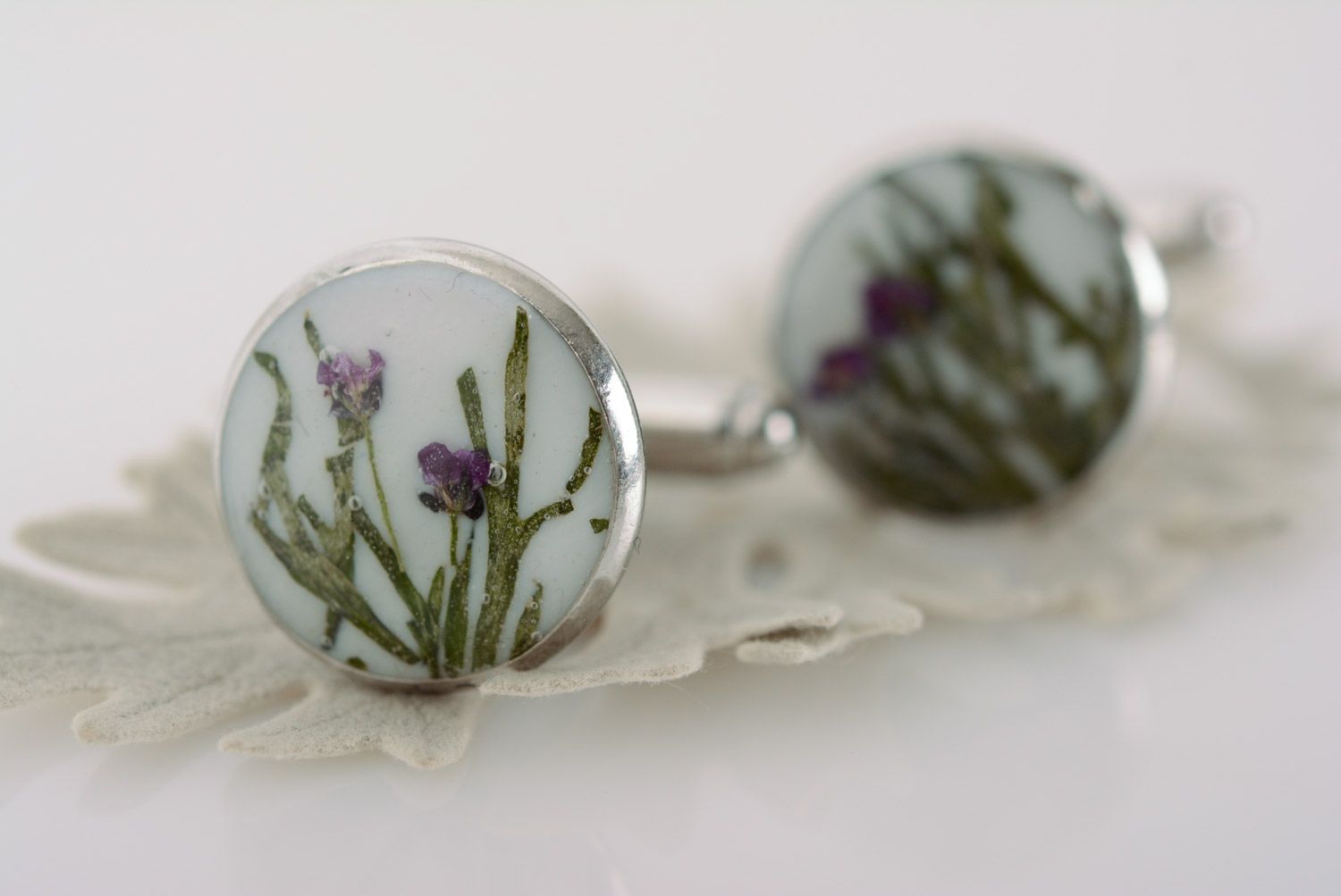 Handmade cufflinks with dried flowers coated with epoxy and with metal fittings photo 1