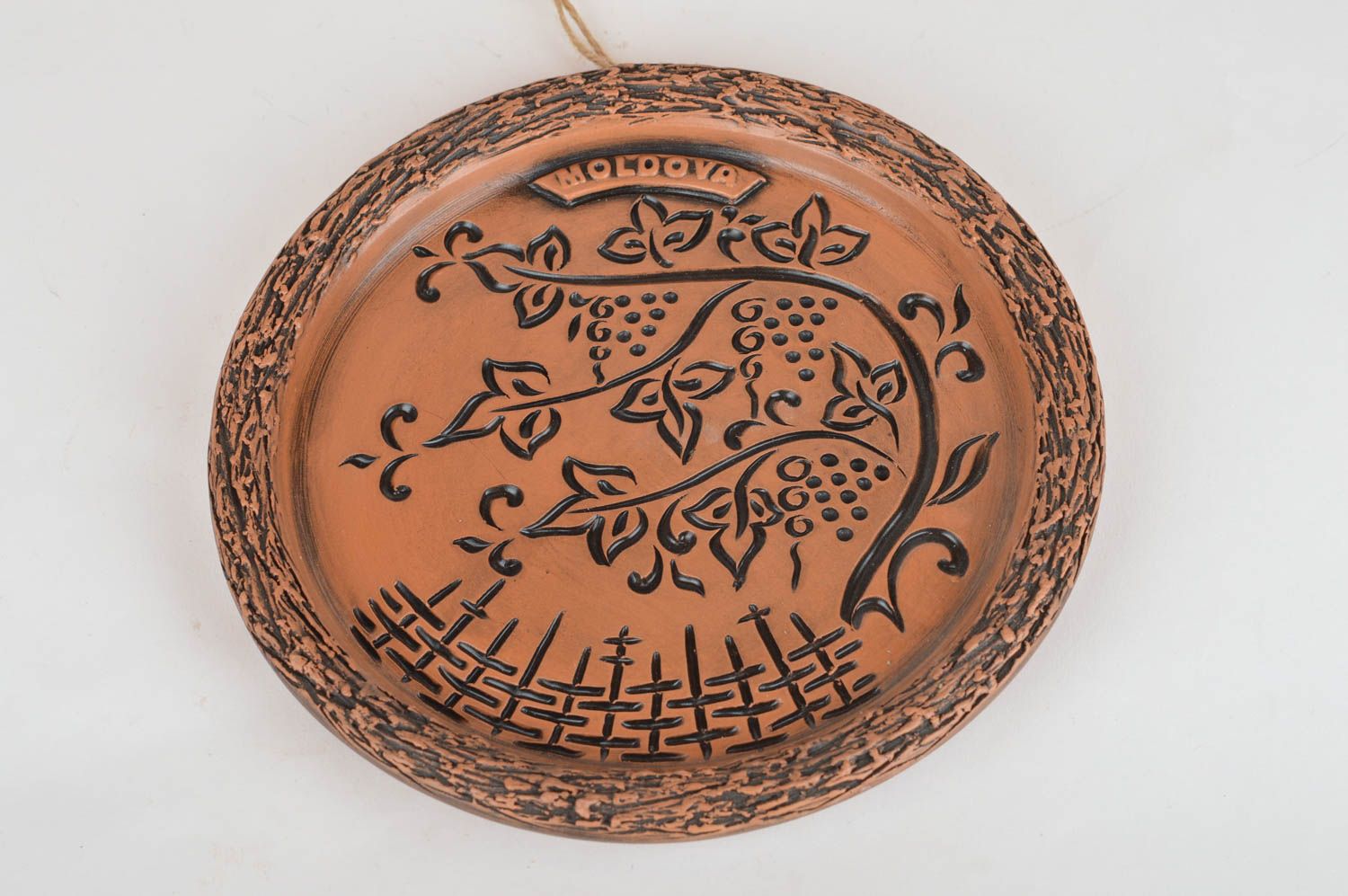 Belle assiette en céramique ethnique ronde faite main avec ornements murale photo 5