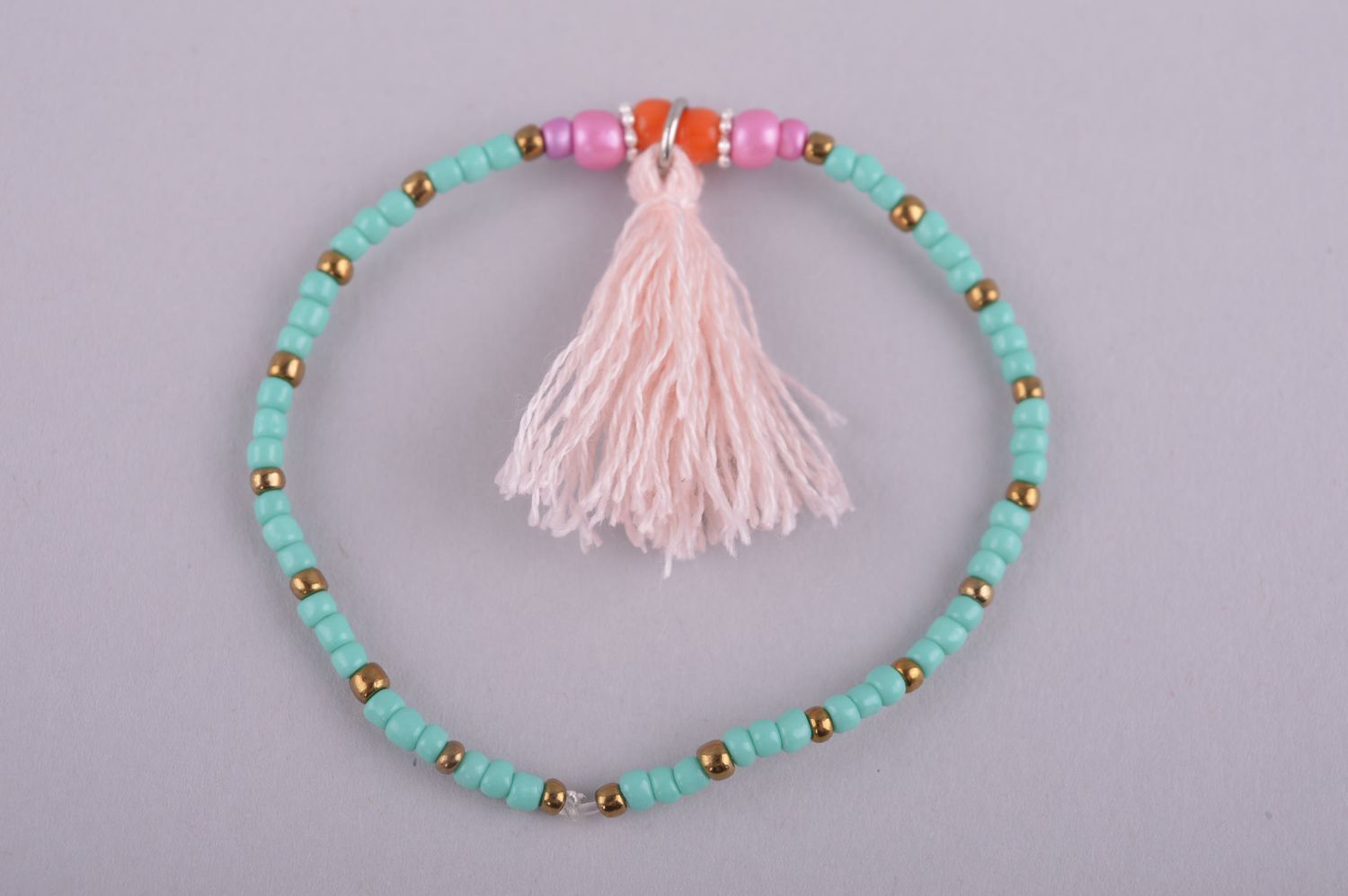 Stretch turquoise and pink handmade bracelet with a pink charm for girls photo 4