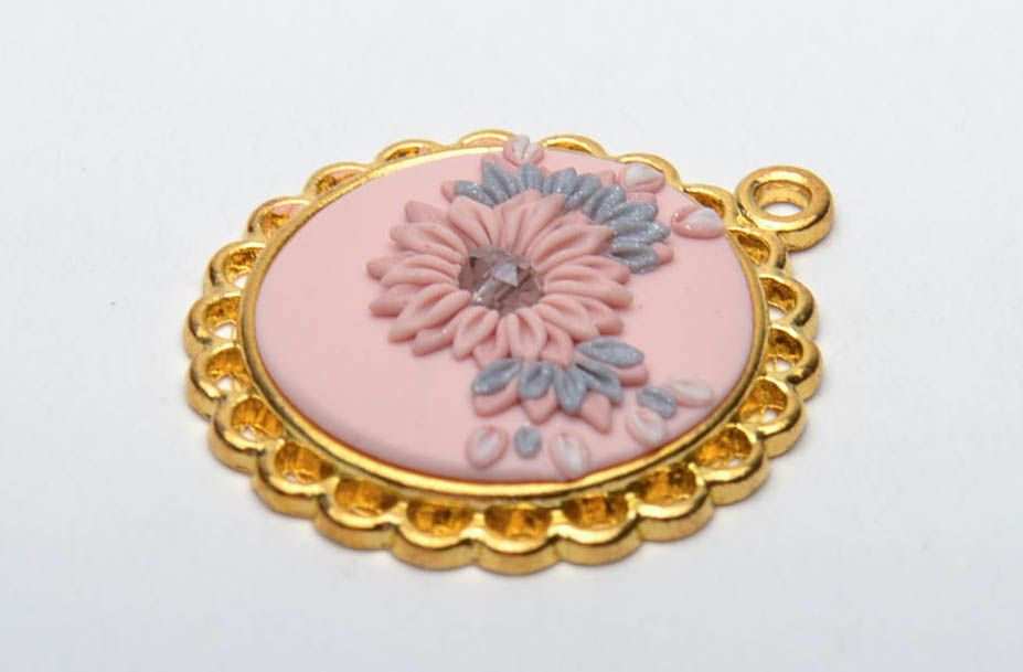 Polymer clay pendant with golden-colored frame photo 2