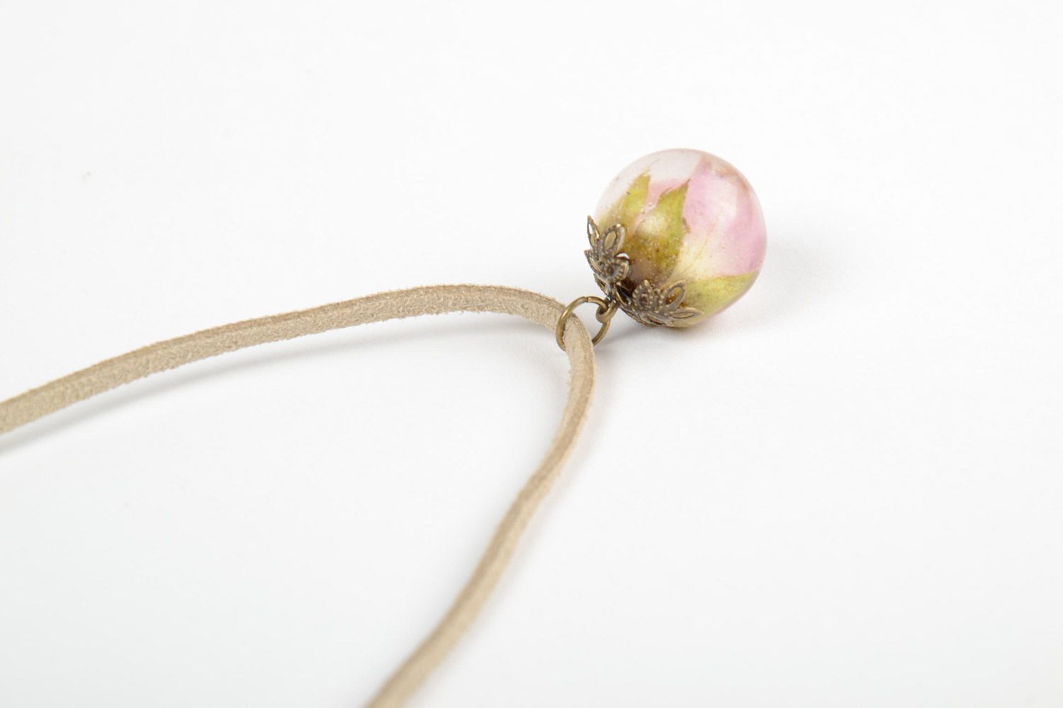 Small tender handmade ball-shaped pendant with rose in epoxy resin on suede cord photo 4