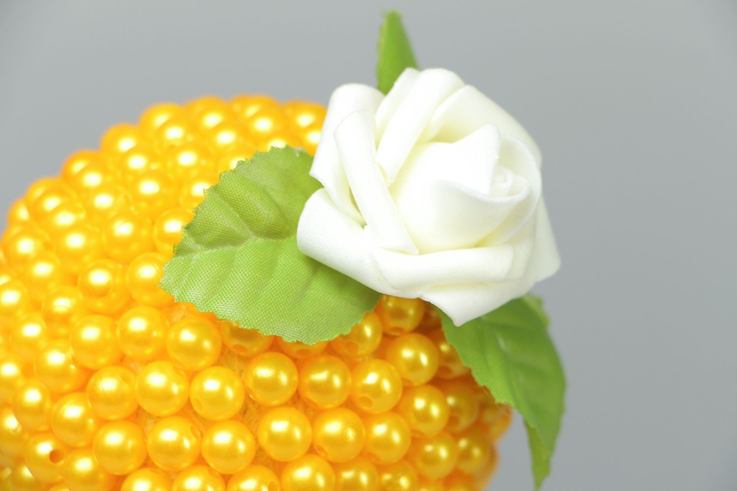 Yellow topiary with pearl-like beads photo 2