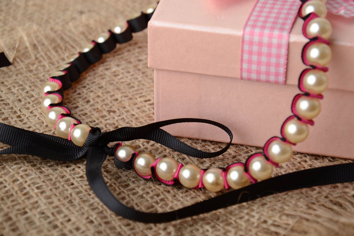 Handmade necklace with pink plastic pearl like beads and rep ribbons with ties photo 1