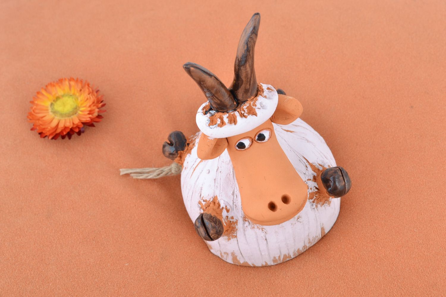 Handmade traditional painted ceramic bell coated with glaze in the shape of goat photo 1