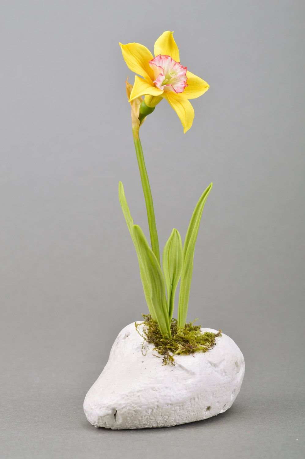 Handmade decorative yellow narcissus flower molded of polymer clay on stone basis photo 1