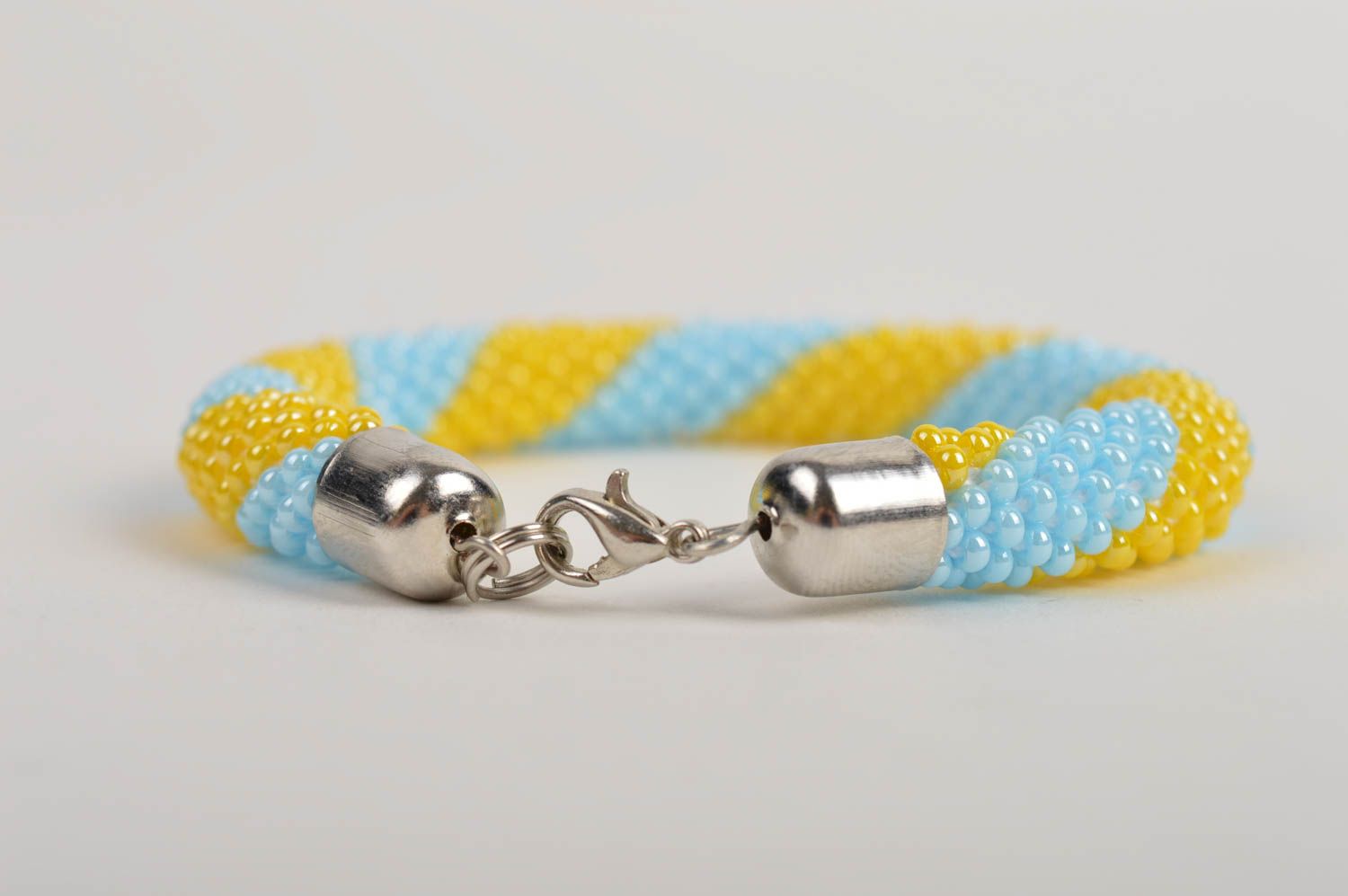 Homemade cord made of Czech beads adjustable bracelet in yellow and blue color photo 4