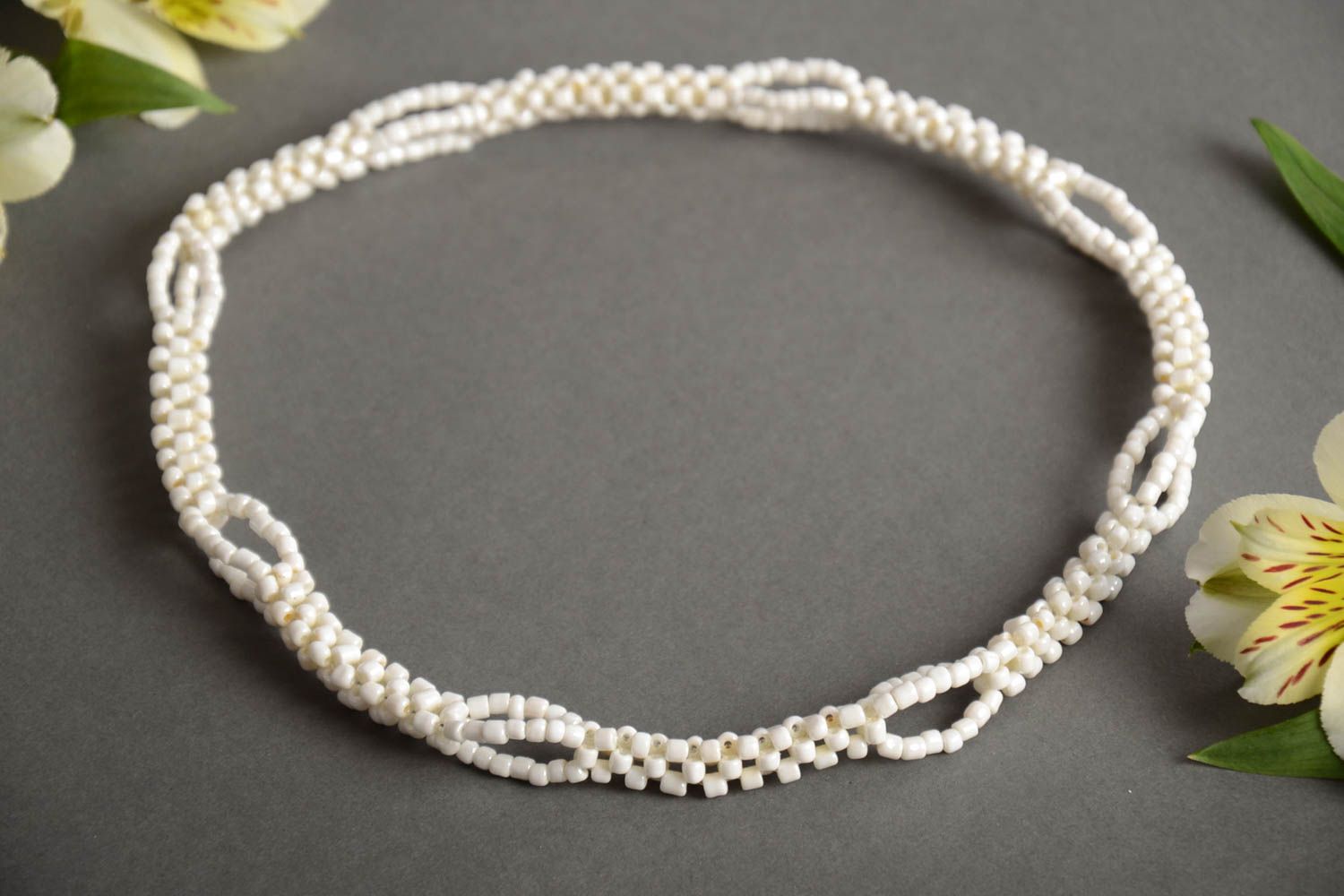 Handmade designer women's thin laconic crocheted beaded necklace of white color  photo 1