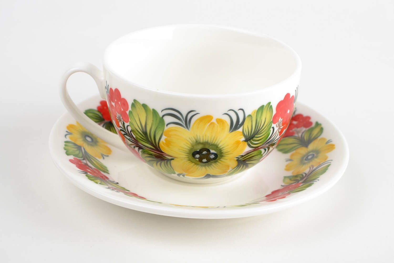 White porcelain elegant teacup with handle and Russian style floral pattern photo 3