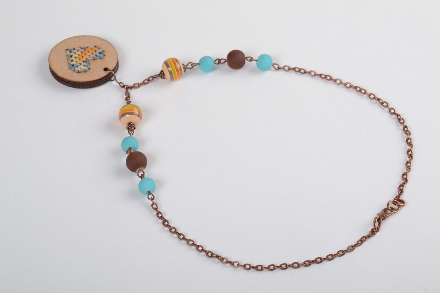 Handmade plywood pendant on a long chain with embroidery and beads for women photo 5
