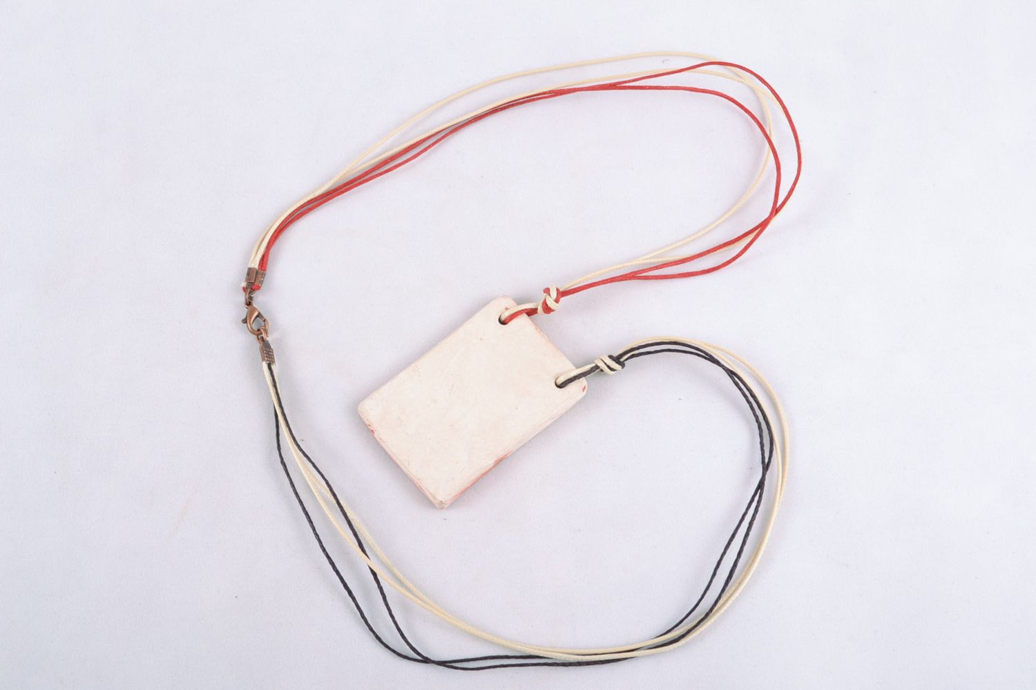 Rectangular ceramic pendant with colorful cords photo 4