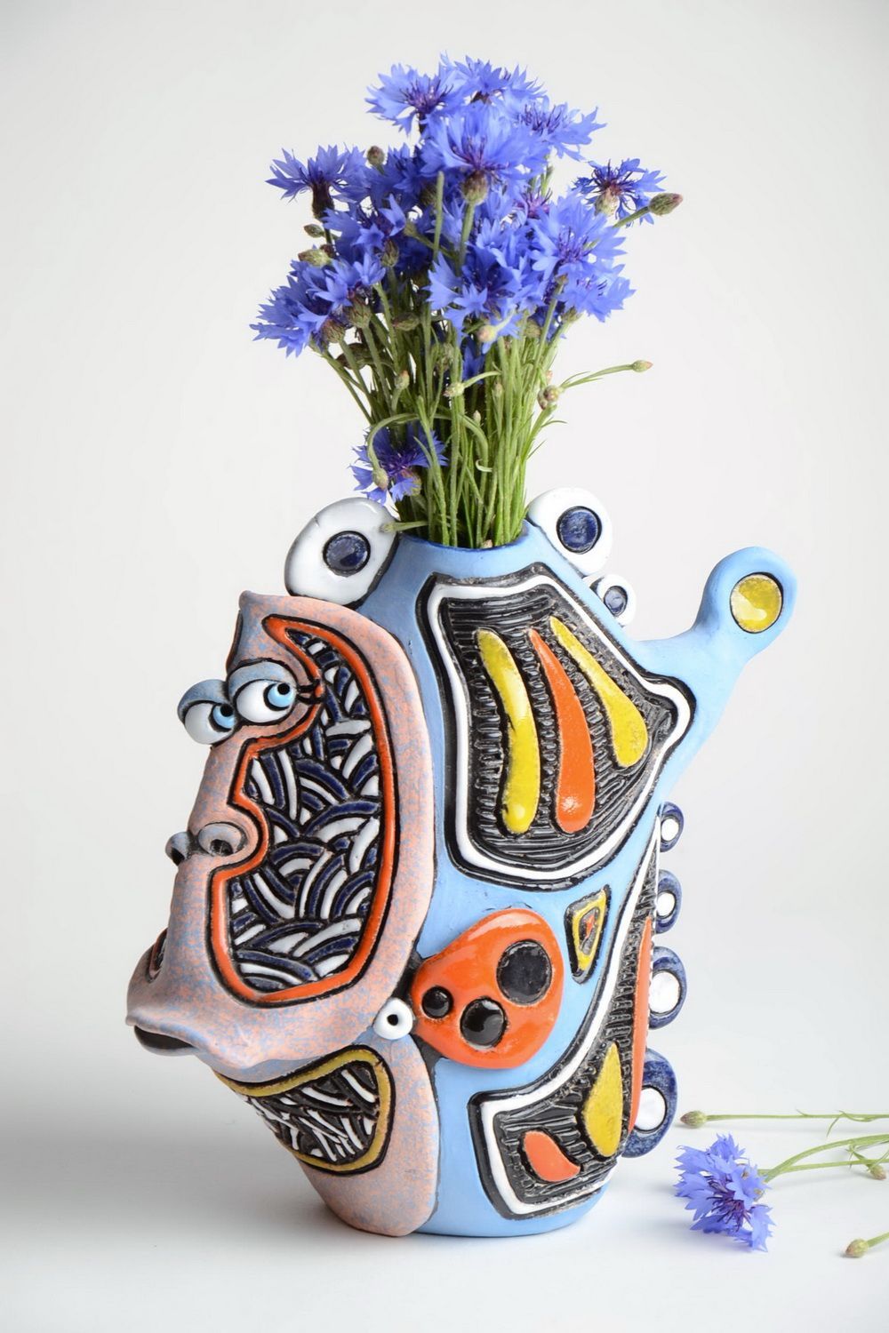 Handmade 10 inches ceramic vase in the shape of the fish in blue, black, yellow, orange colors photo 1
