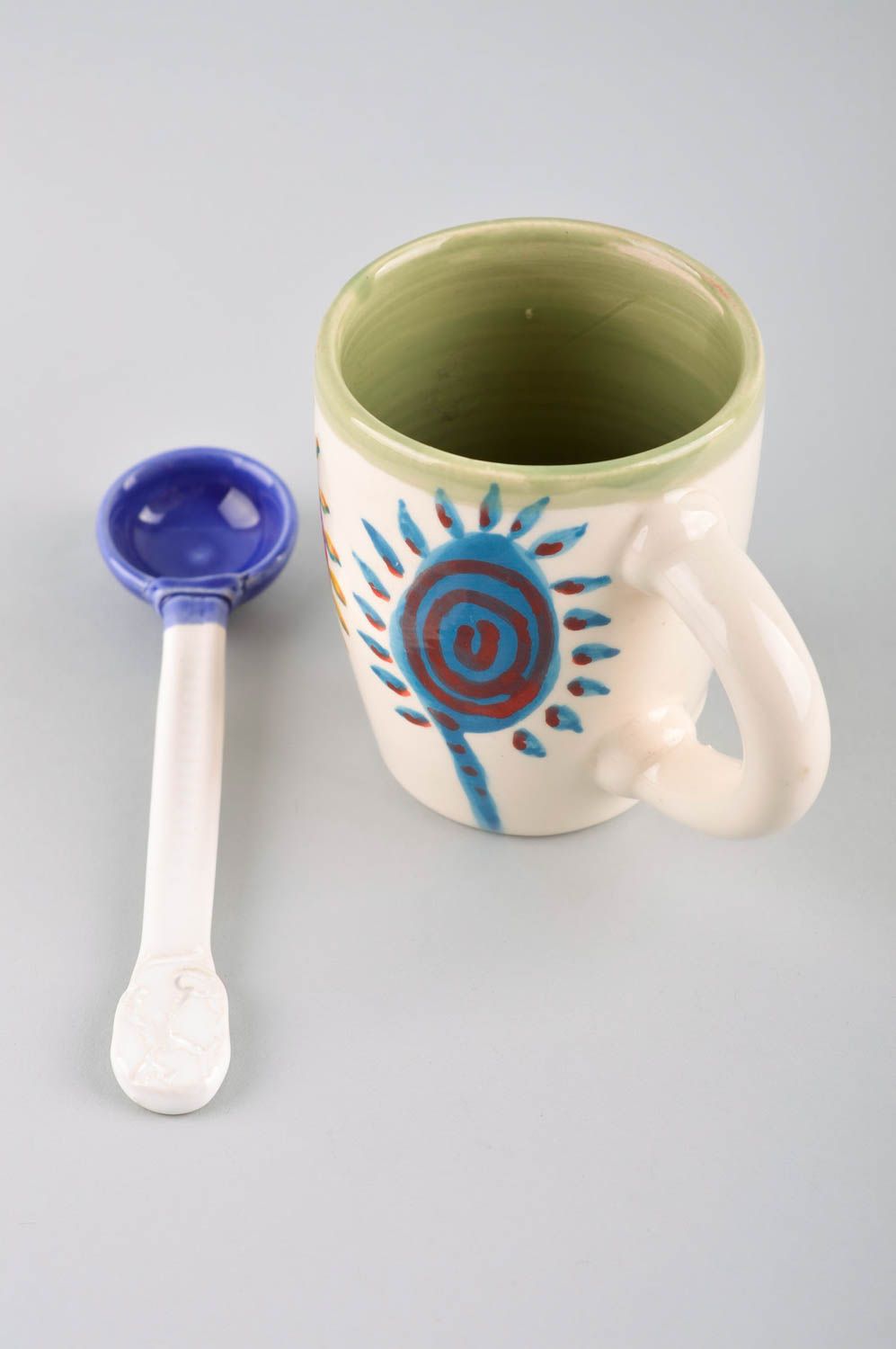 Ceramic glazed cup with ceramic spoon and sun cave pattern photo 3