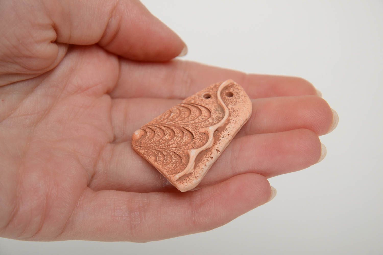 Handmade decorative flat ceramic blank pendant with wave shaped pattern photo 5