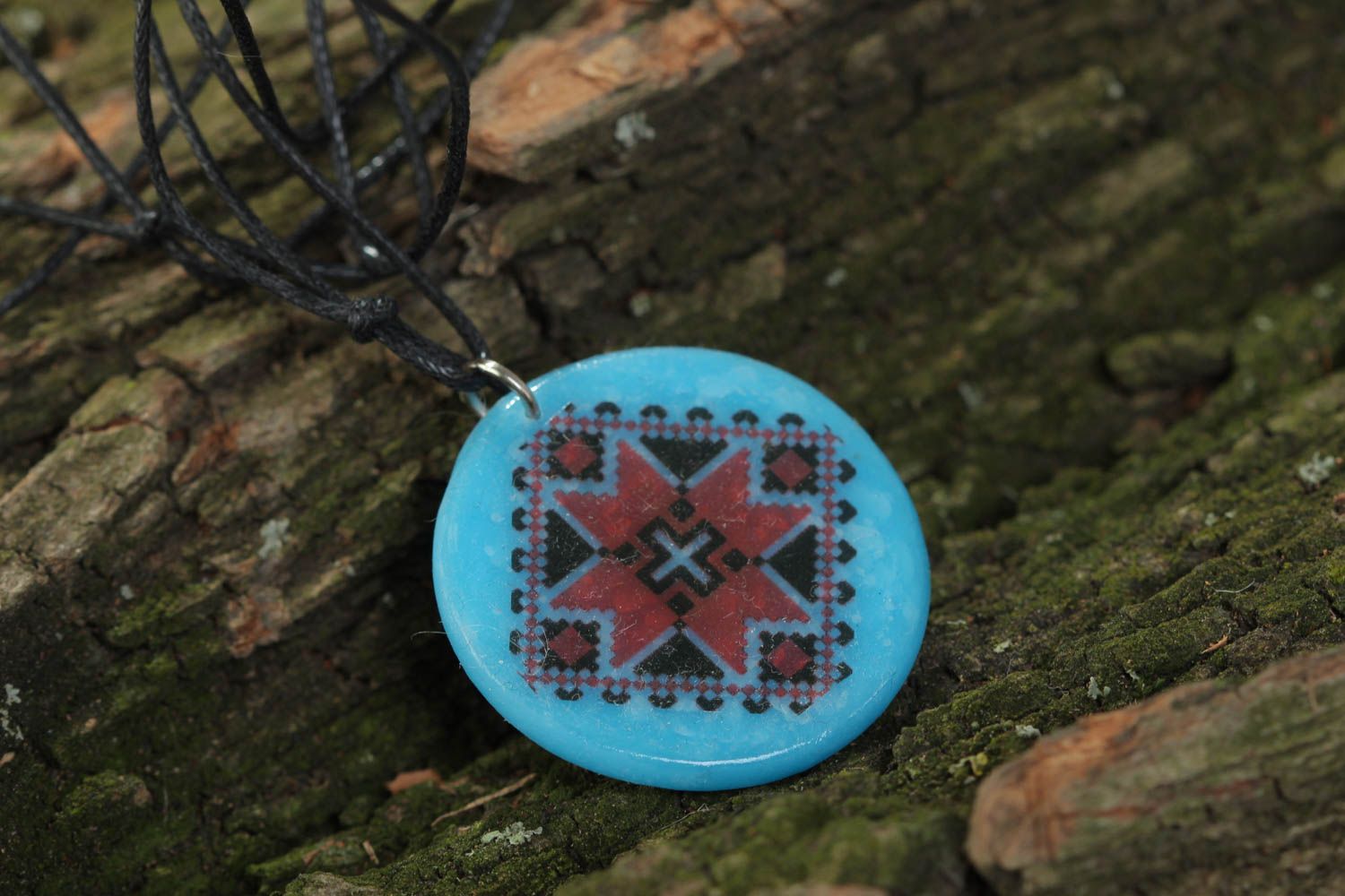 Handmade designer pendant with Ukrainian symbols round blue accessory on cord  photo 1