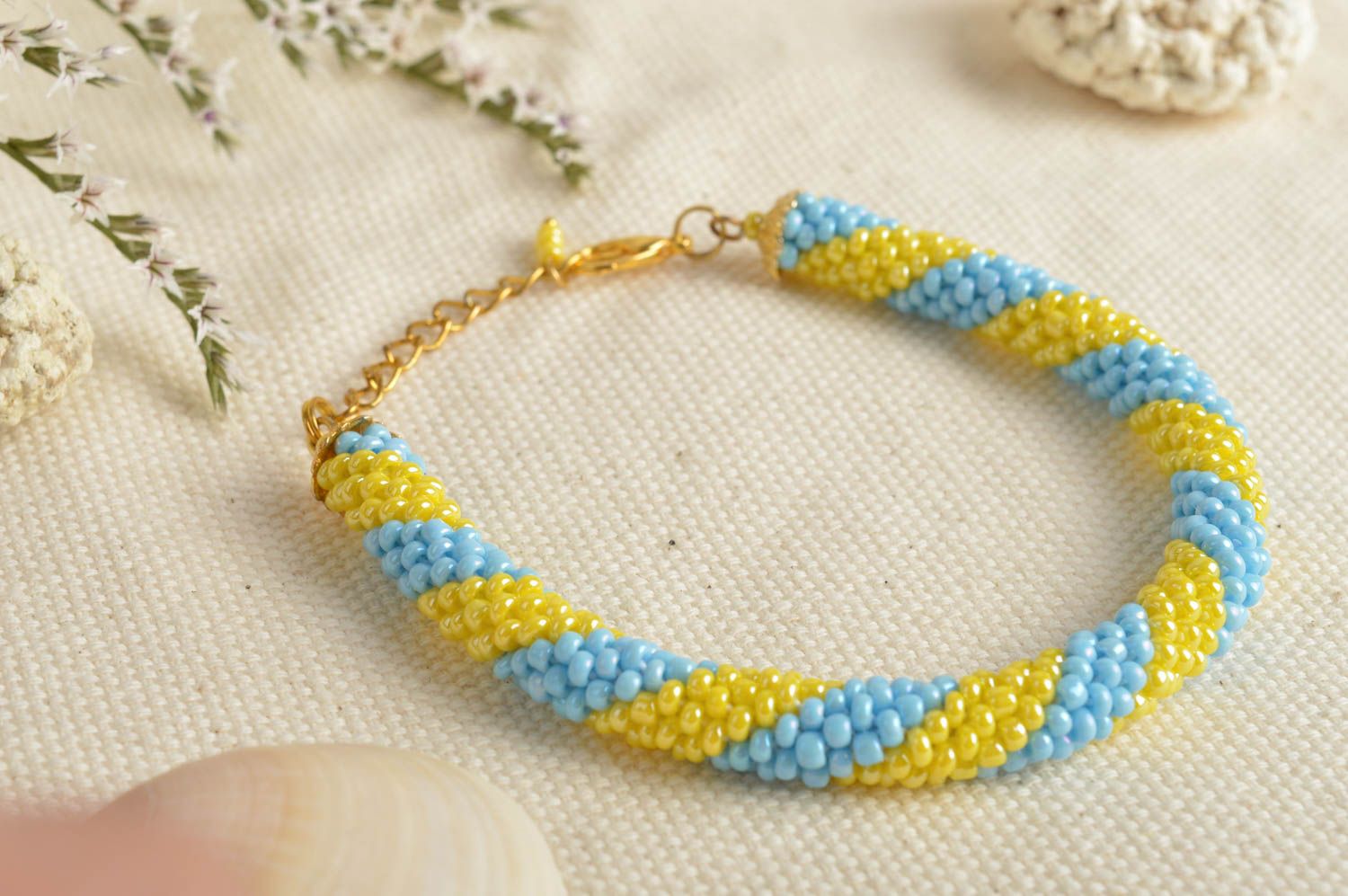 Handmade beaded cord wrist bracelet in blue and yellow colors for women photo 1