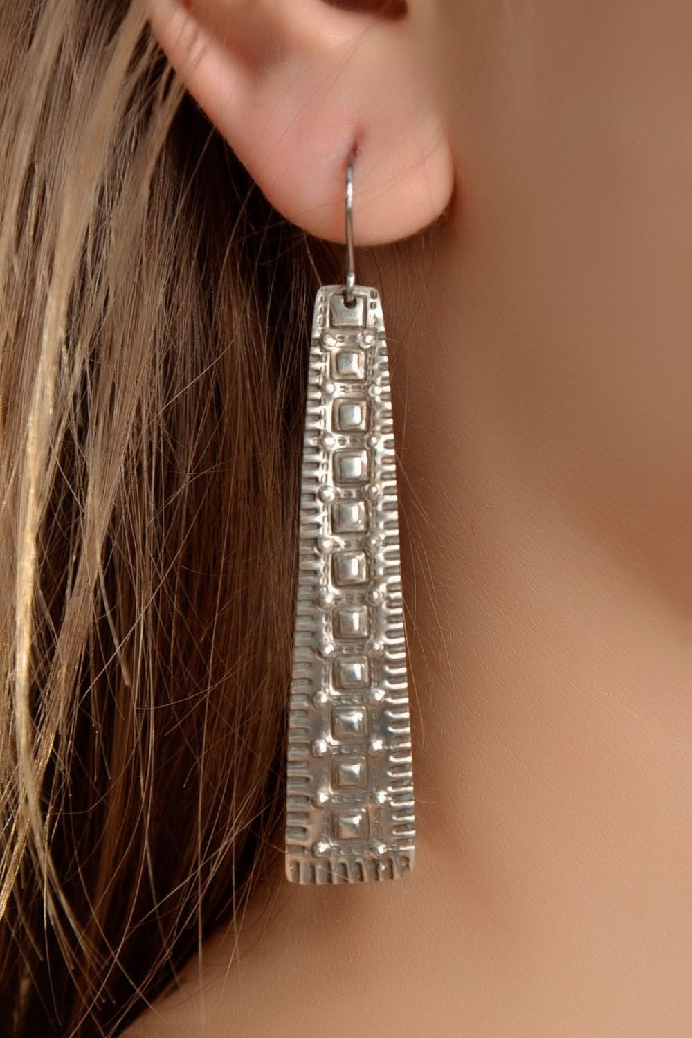 Long metal earrings with ornament photo 4