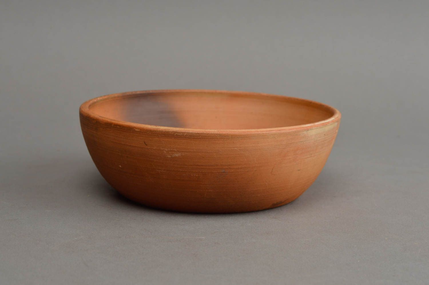 Handmade small ethnic smooth brown ceramic bowl for serving hot and cold dishes photo 3
