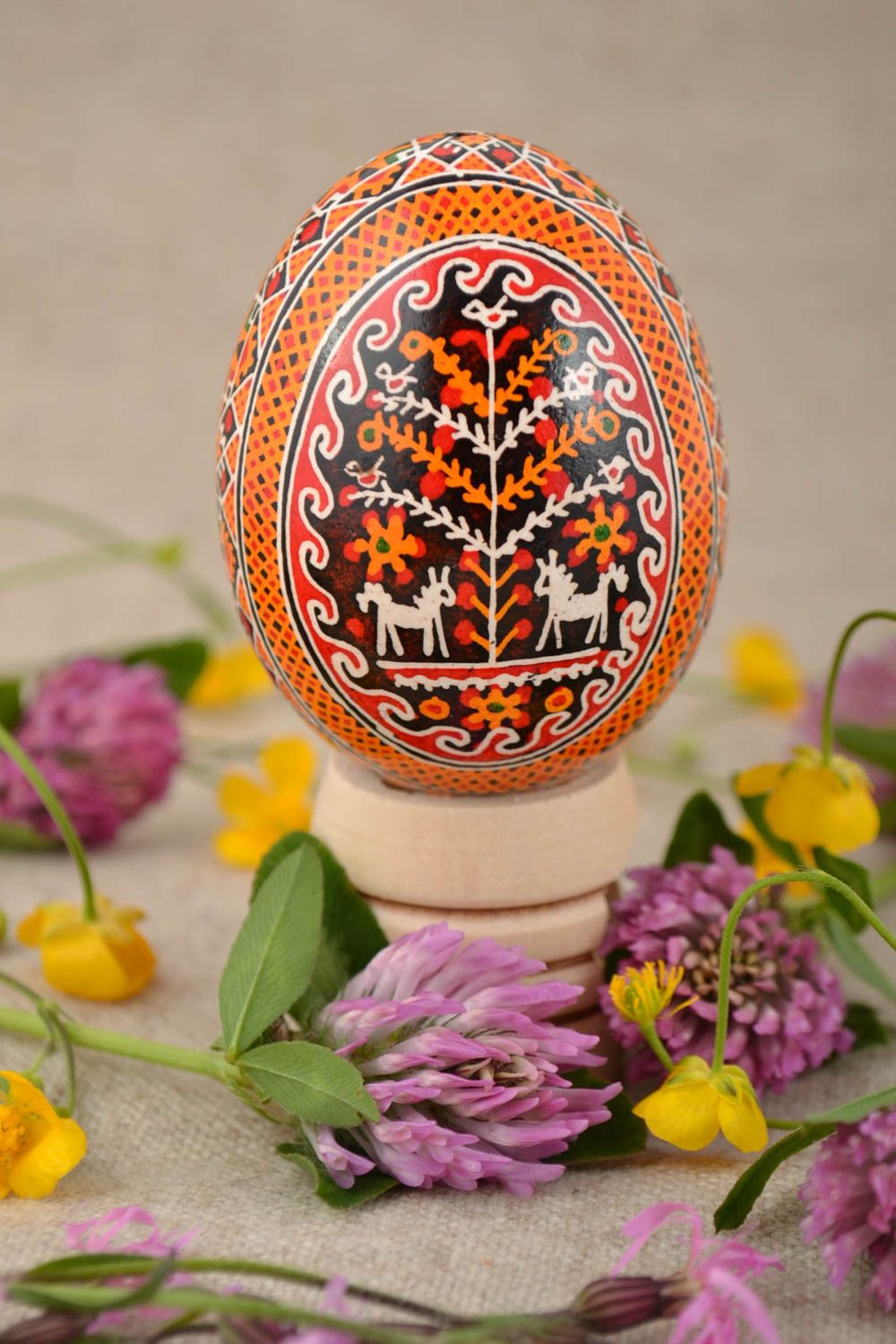 Handmade painted Easter egg with pattern in orange color palette home decor photo 1