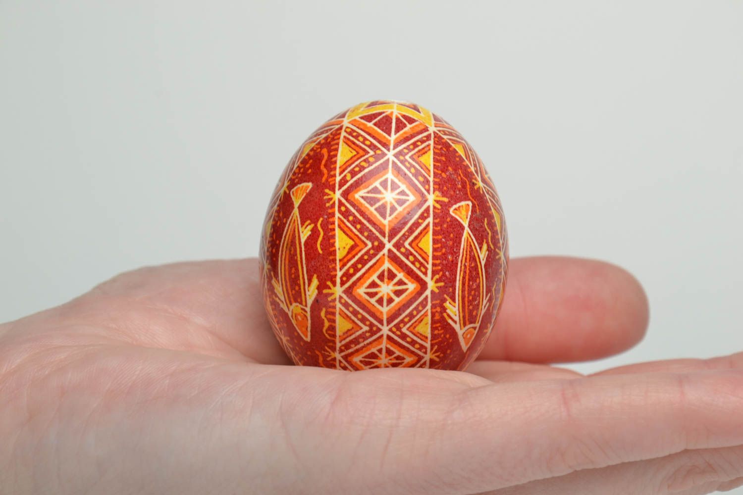 Handmade pysanka decorated with image of fish using wax technique photo 5