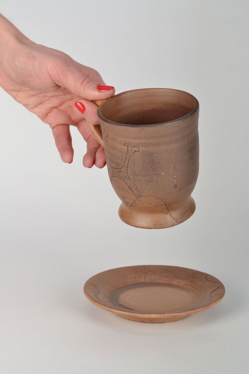 Tazza in ceramica con piattino fatta a mano calice in argilla utensili da cucina foto 2