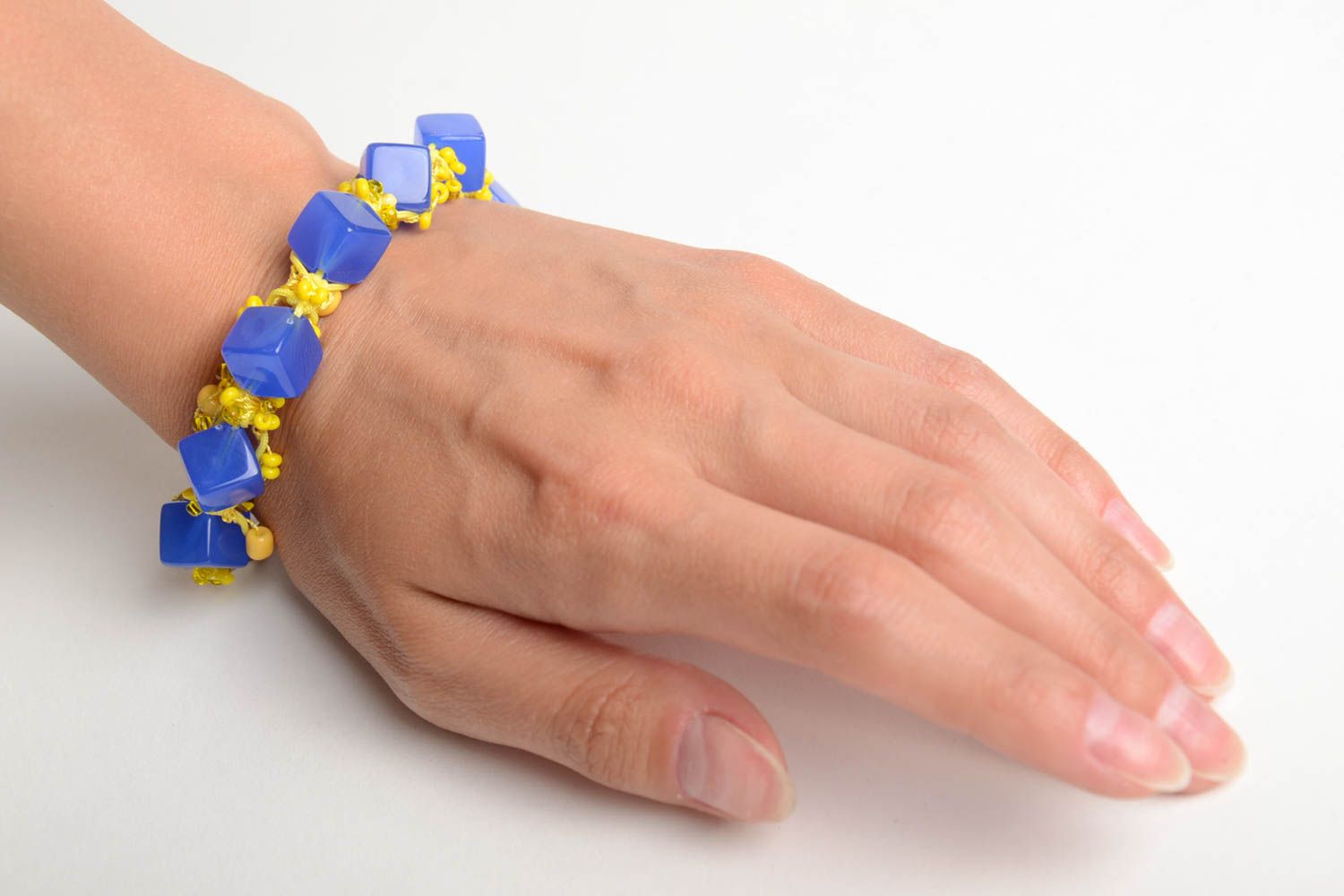 Handmade wrist bracelet crocheted of beads in yellow and blue color combination photo 2