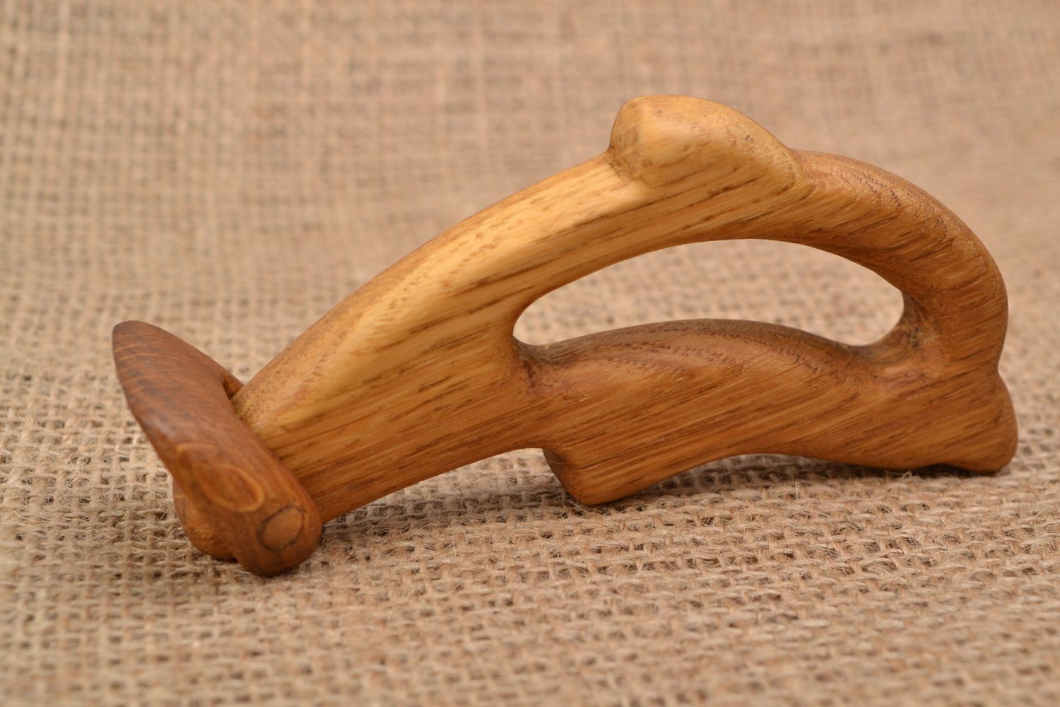Handmade wooden teething toy in the shape of dolphin imbued with linseed oil photo 5