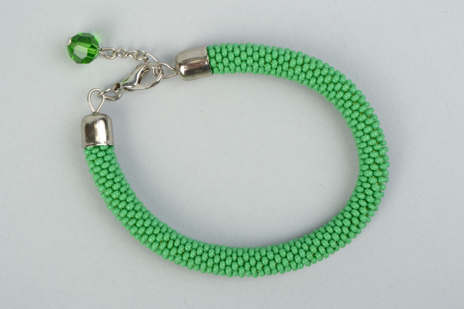 Beautiful handmade tender green beaded cord women's wrist bracelet with charm photo 2