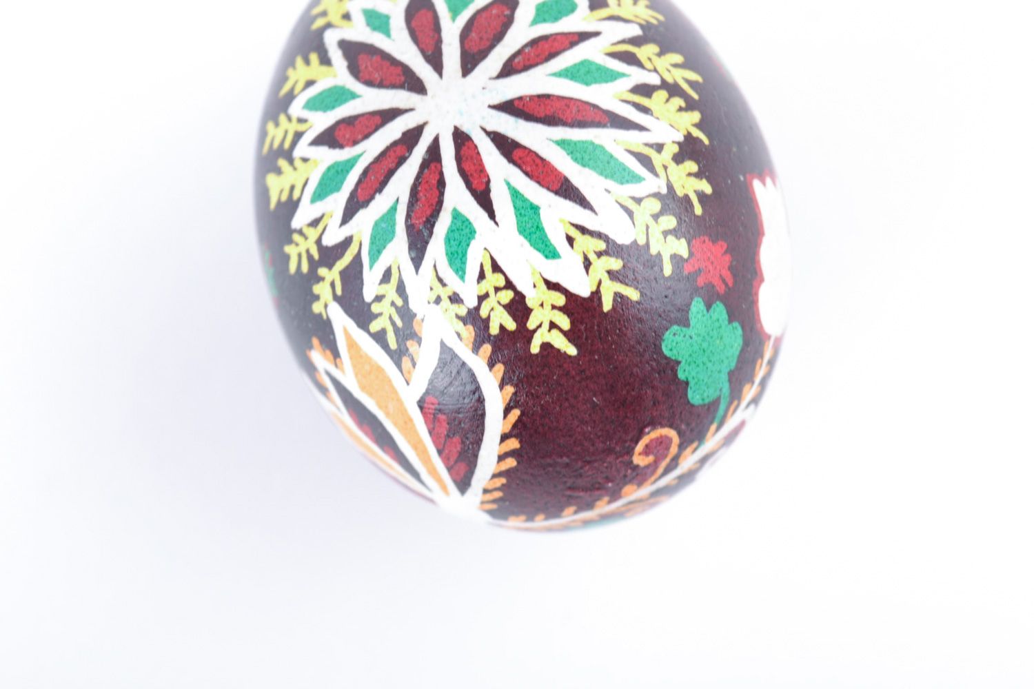 Handmade designer painted Easter egg with floral ornaments on dark background photo 4