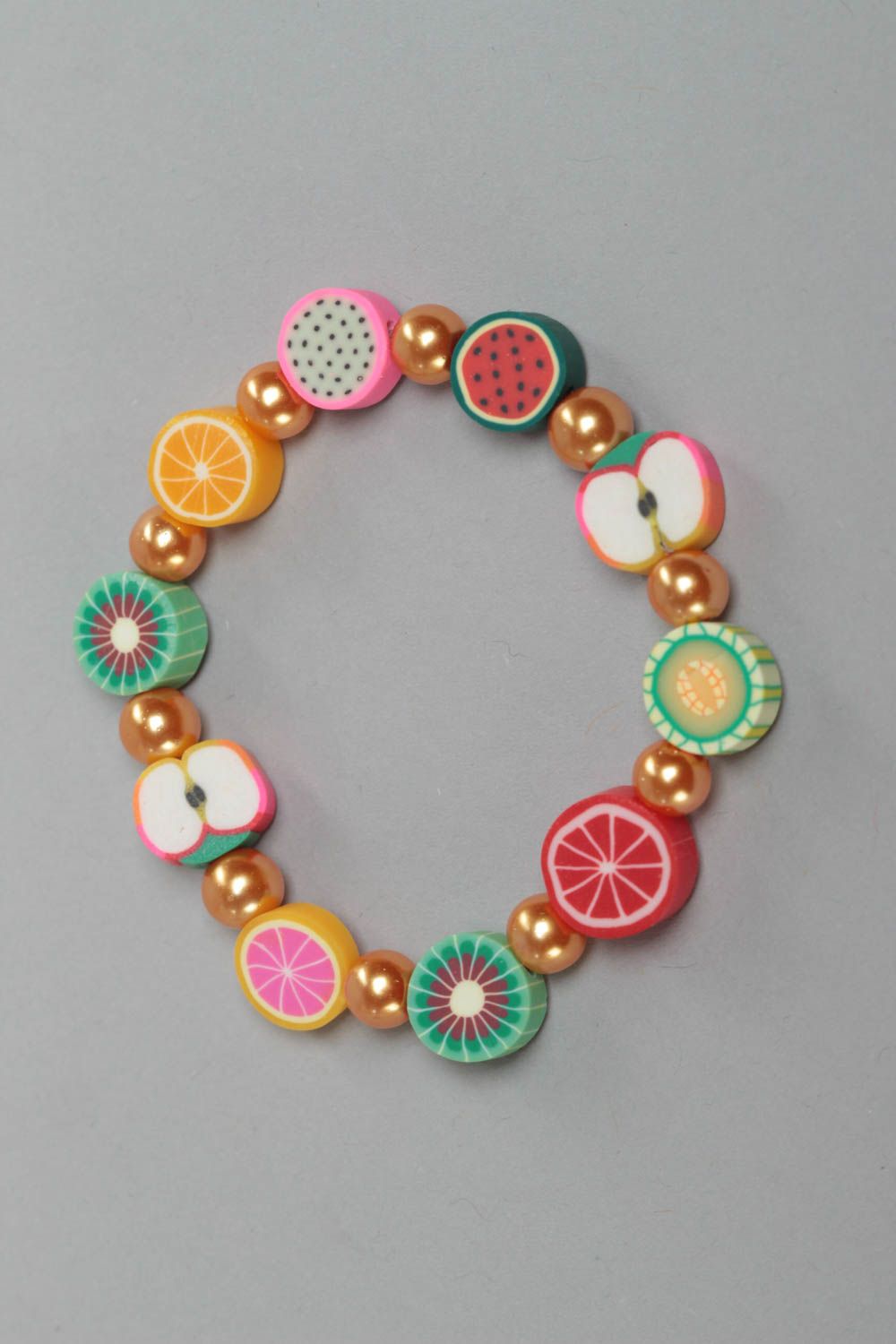 Beautiful bright handmade children's wrist bracelet with polymer clay fruit photo 2