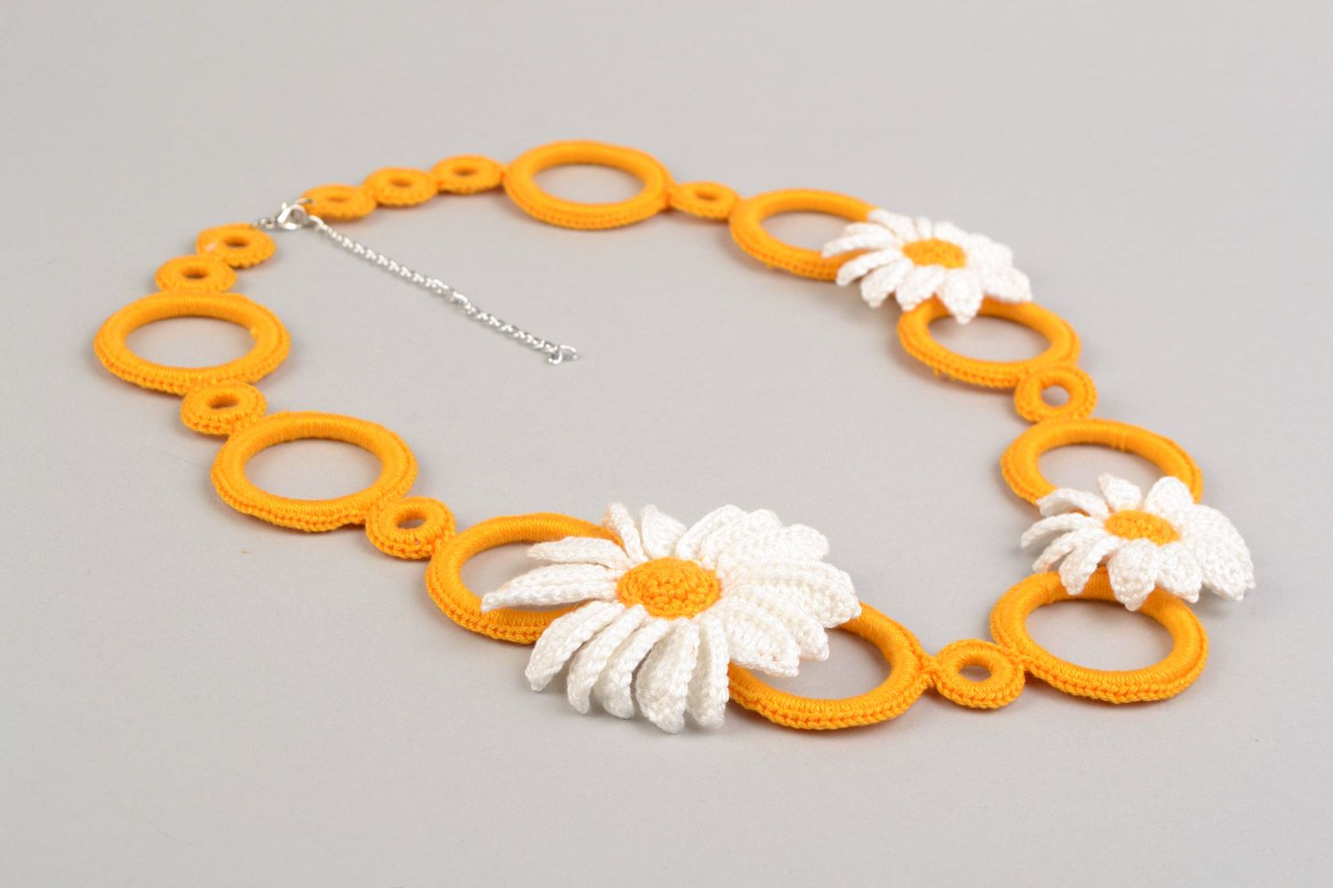 Handmade orange necklace with daisies braided of threads on plastic rings photo 4