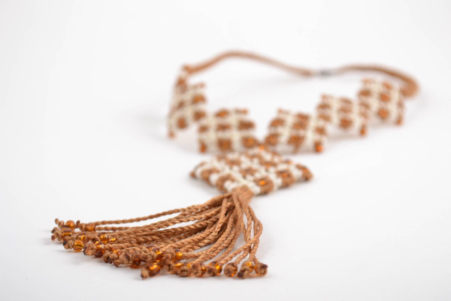 Handmade designer macrame necklace woven of threads with tassel white and beige photo 3
