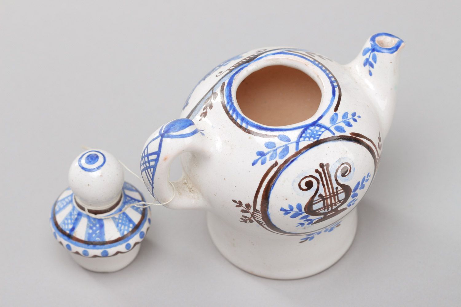 Керамический декоративный чайник с крышкой ручной работы покрытый эмалью фото 4