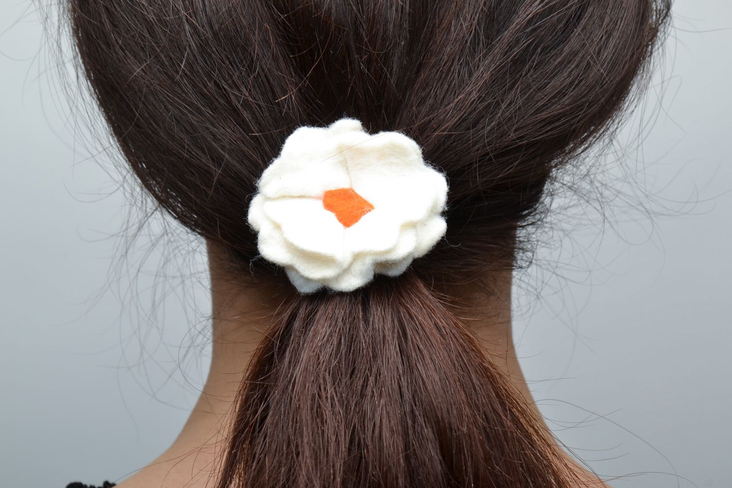 Beautiful tender hair tie with white flower photo 2
