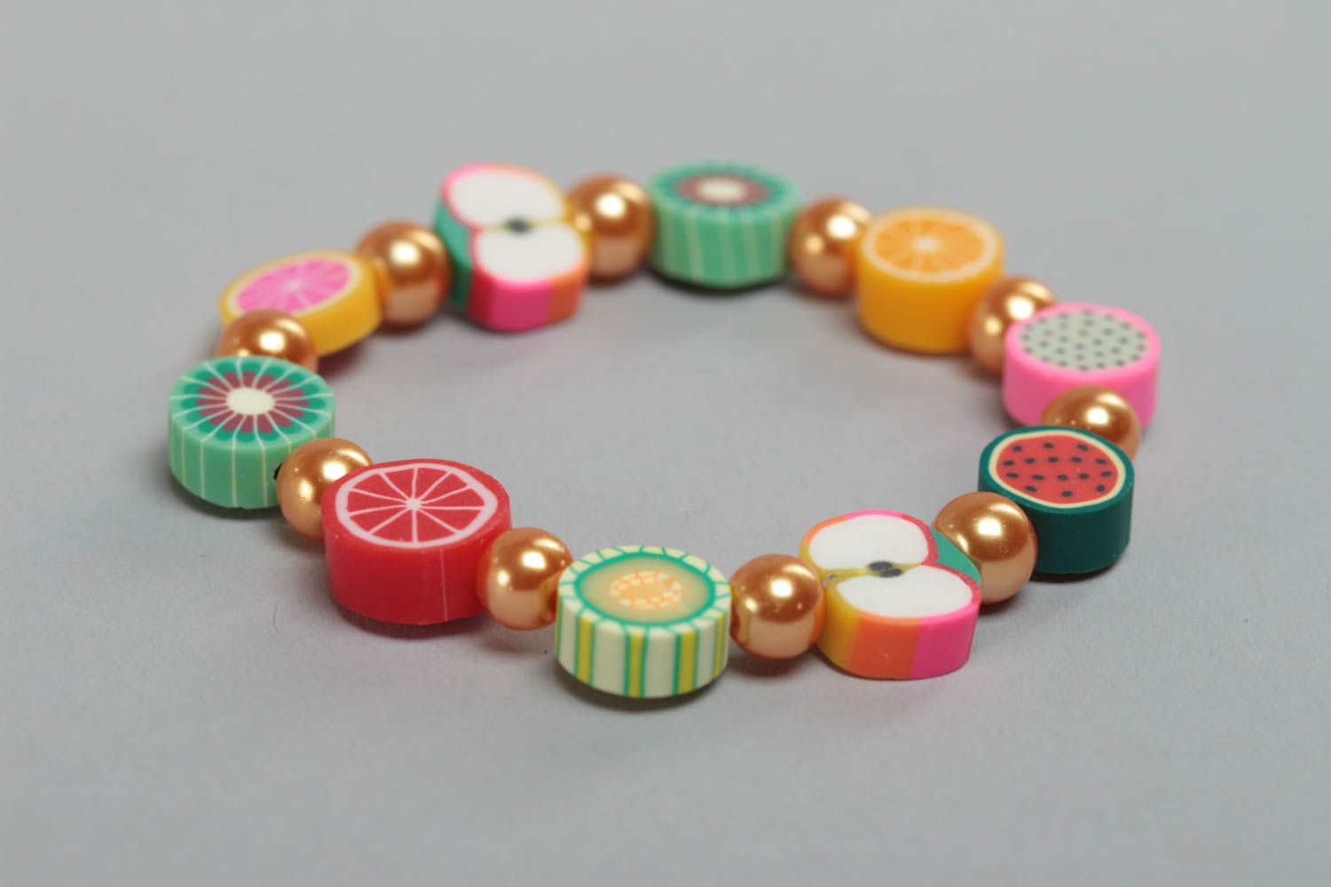 Beautiful bright handmade children's wrist bracelet with polymer clay fruit photo 3