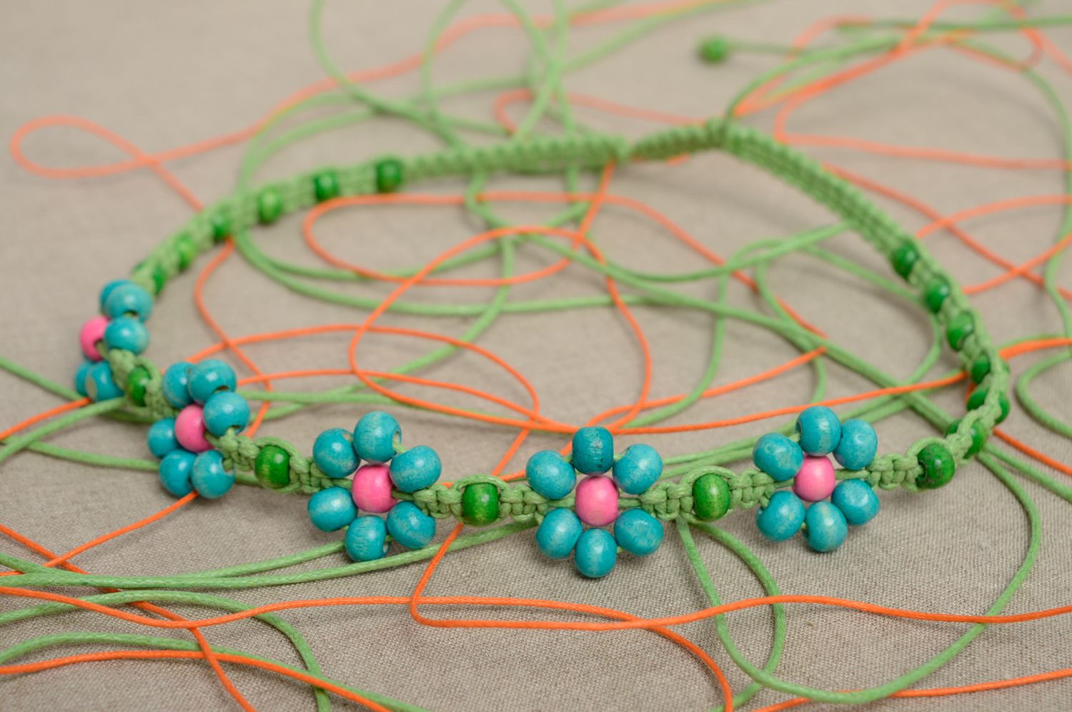 Woven macrame transforming jewelry with wooden beads photo 1