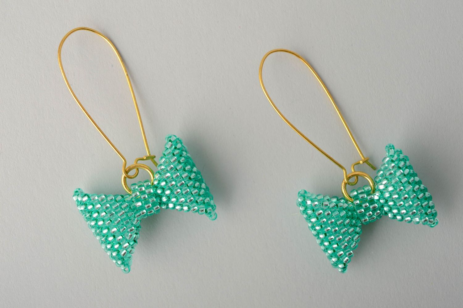 Turquoise handmade beaded earrings Bows photo 1