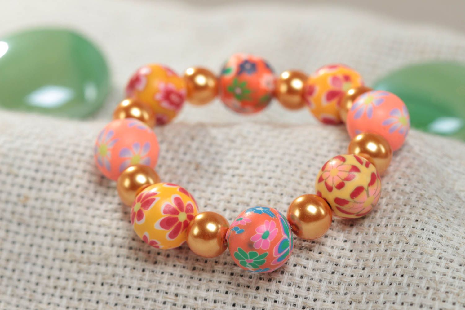 Orange handmade children's bracelet created of polymer clay and ceramic beads photo 1