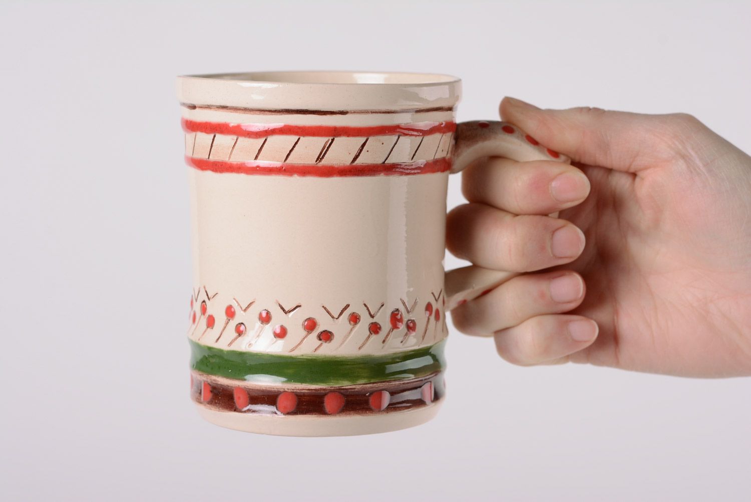 Glazed maiolica ceramic cup painted with red and green dots in the Ukrainian style photo 5