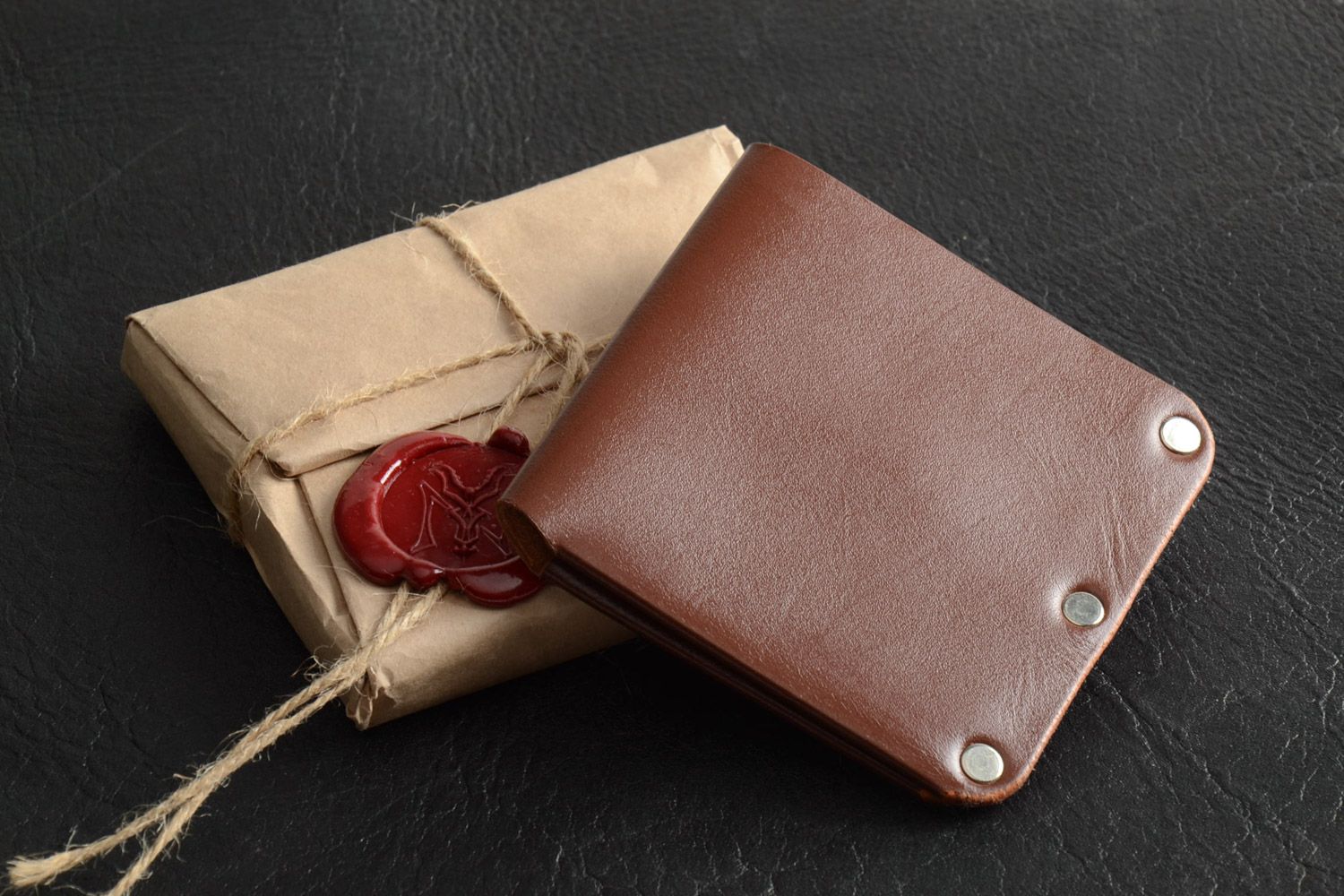 Men's wallet hand made of genuine leather of brown color with metal fittings photo 1