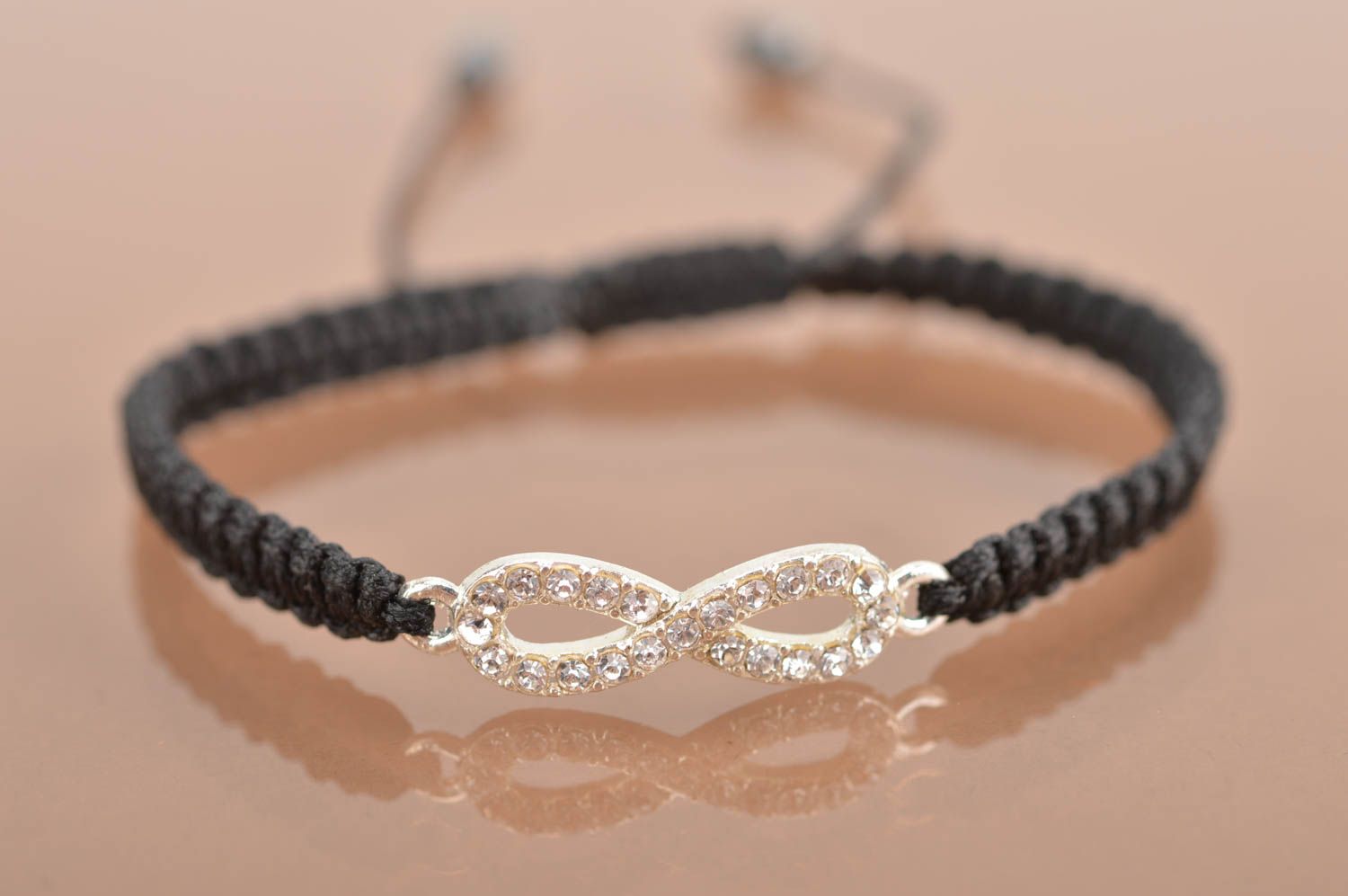 Handmade cute thin black woven wrist bracelet made of silk with insert photo 2