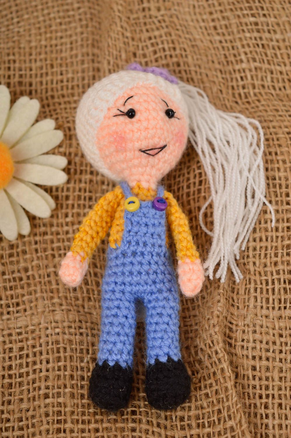Knitted stuffed girl toy in blue jeans and pink sweater and blond hair. 4 inches tall photo 1