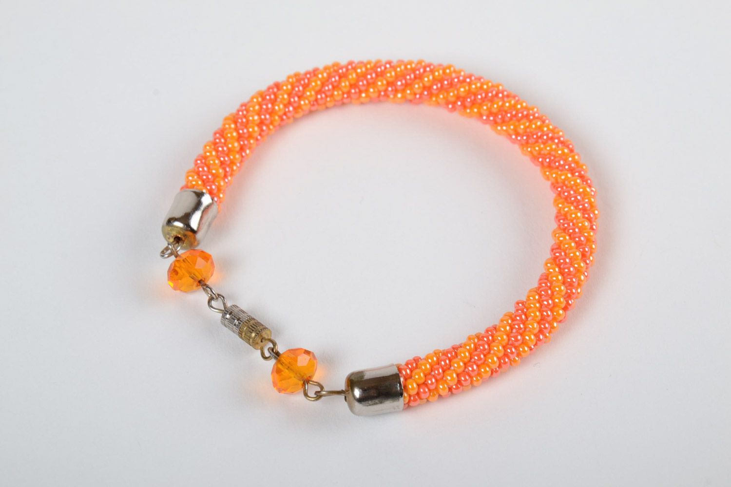 Handmade female bright beautiful designer beaded cord bracelet in orange color photo 2