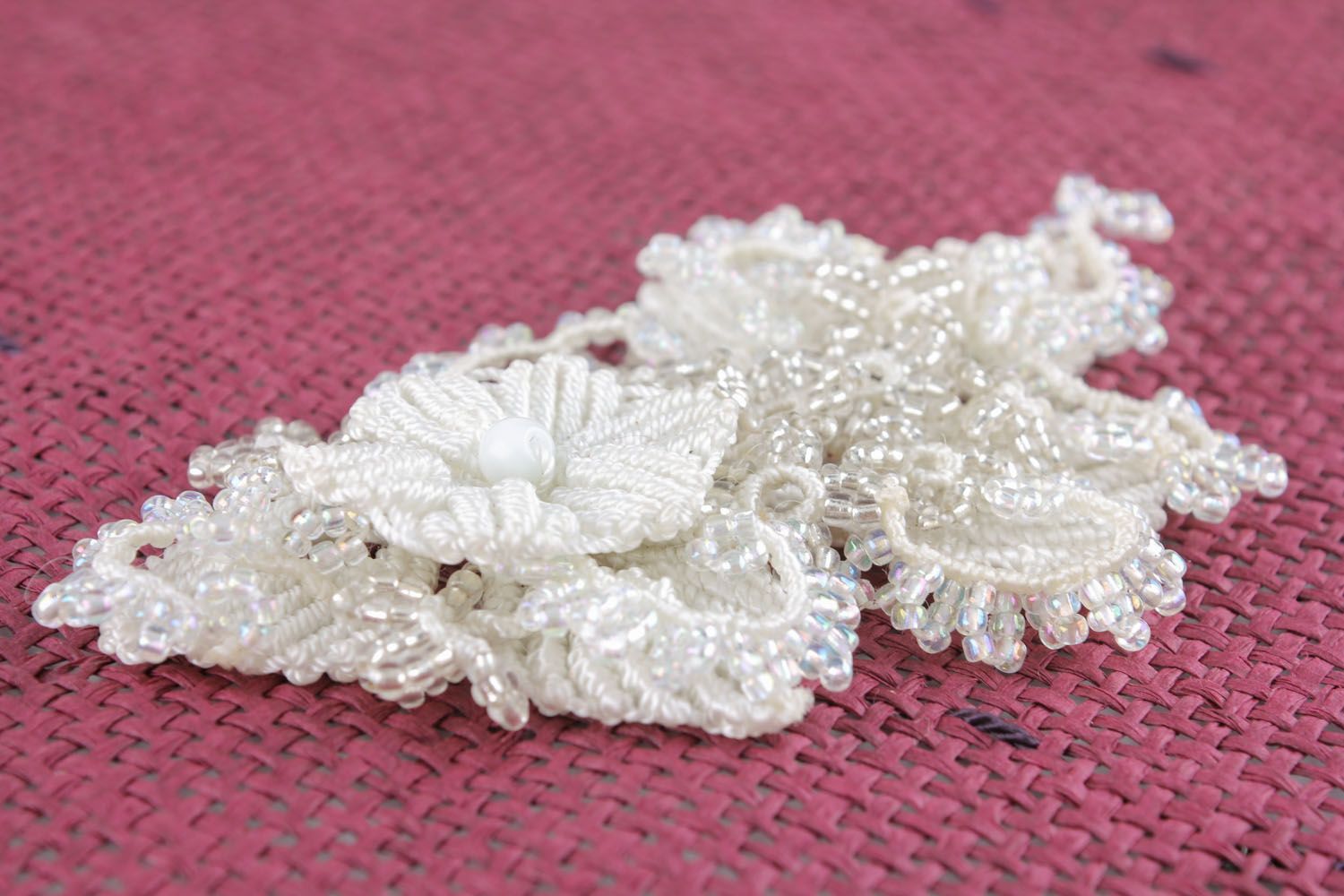 White brooch made of threads and beads photo 2