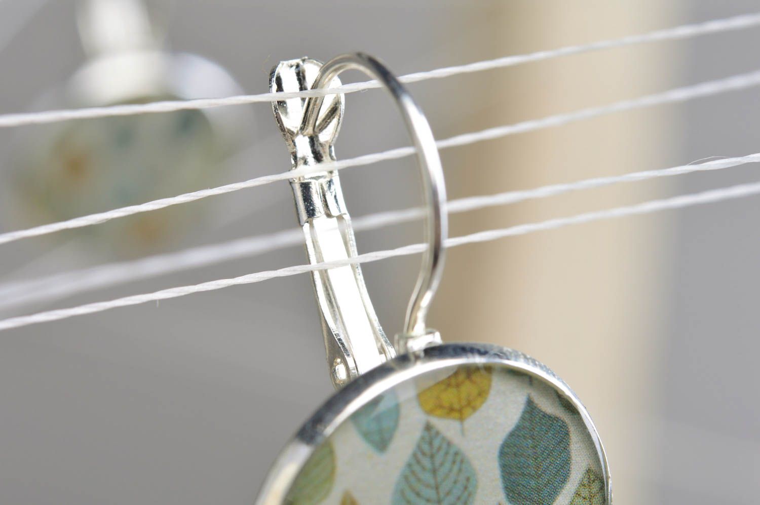 Handmade designer light round decoupage dangling earrings in epoxy resin Leaves photo 2