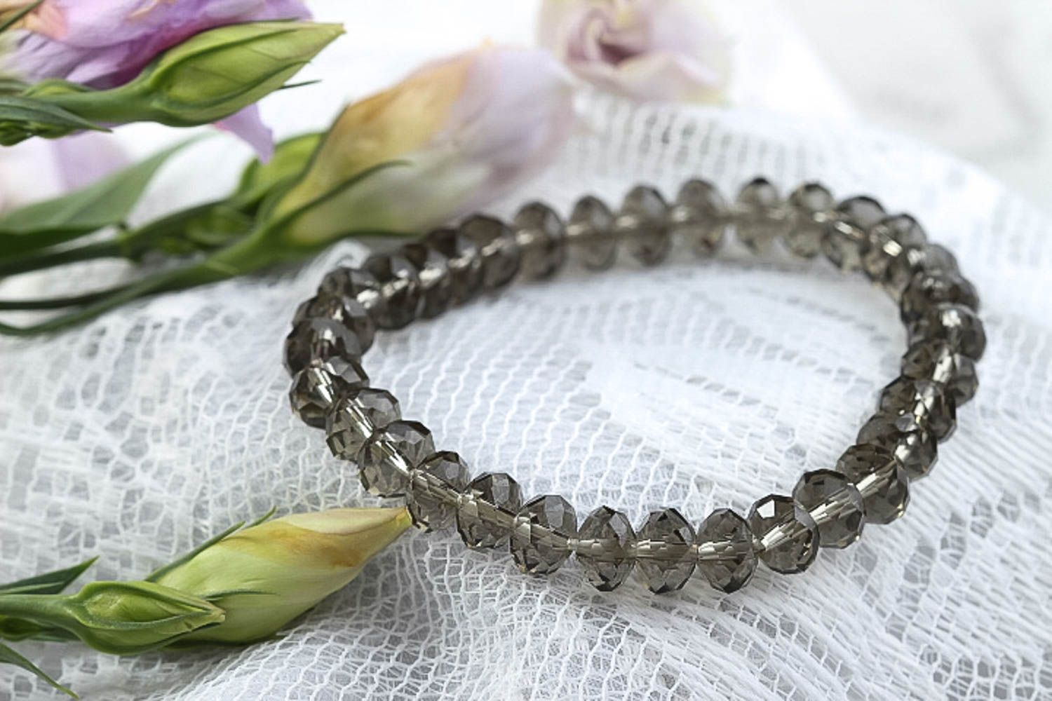 Handmade transparent light glass beads bracelet on an elastic string photo 1